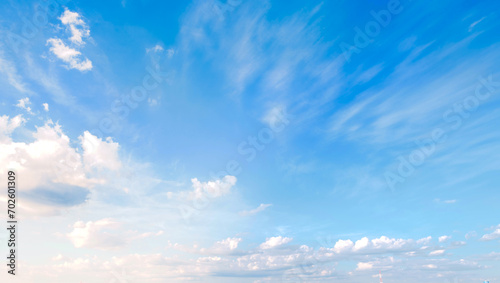 Blue sky with some clouds. View over the clouds light background