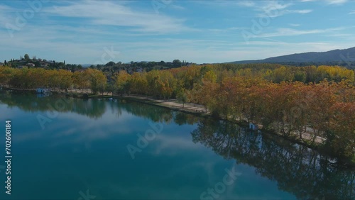 Autumn at Banyoles Lake with blue mirror waters in Girona, Catalonia photo