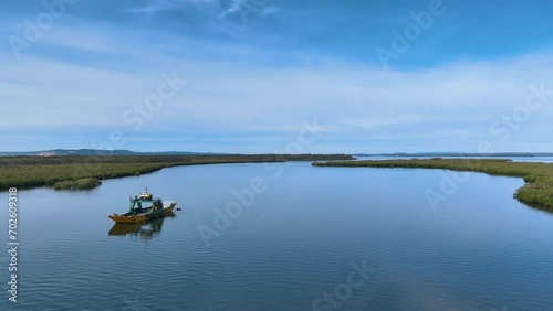 Close up flight over Fraser K'gari Island ferry and barge Inskip Queensland photo