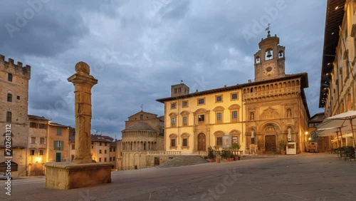 Arezzo, Italy. Time lapse view of  historic architecture on Piazza Grande square at dusk
