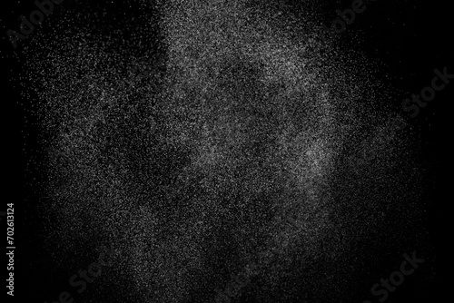Abstract splashes of water on black background. White explosion. Light overlay texture.