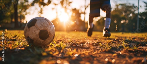 Soccer ball kicked by boy on field © 2rogan