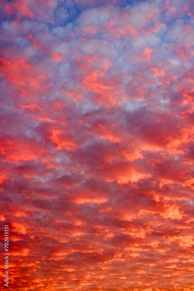 Beautiful landscape with a sky with red-orange hues created due to several meteorological factors.