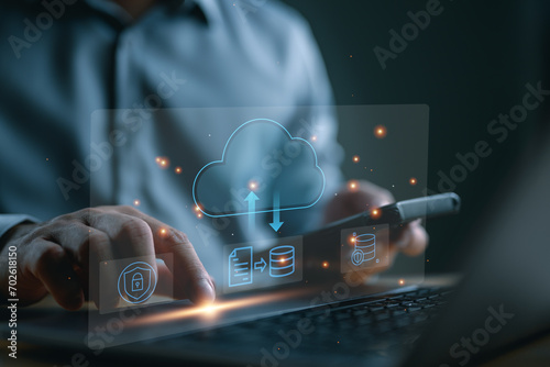Man use Laptop with cloud computing diagram show on virtual screen. Cloud technology. Data storage. Networking and internet service concept. DMS data management system online, upload and download.