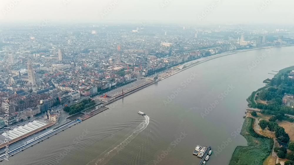 Antwerp, Belgium. River public transport on the river Scheldt (Escaut). Embankment of Antwerp. Summer morning, Aerial View