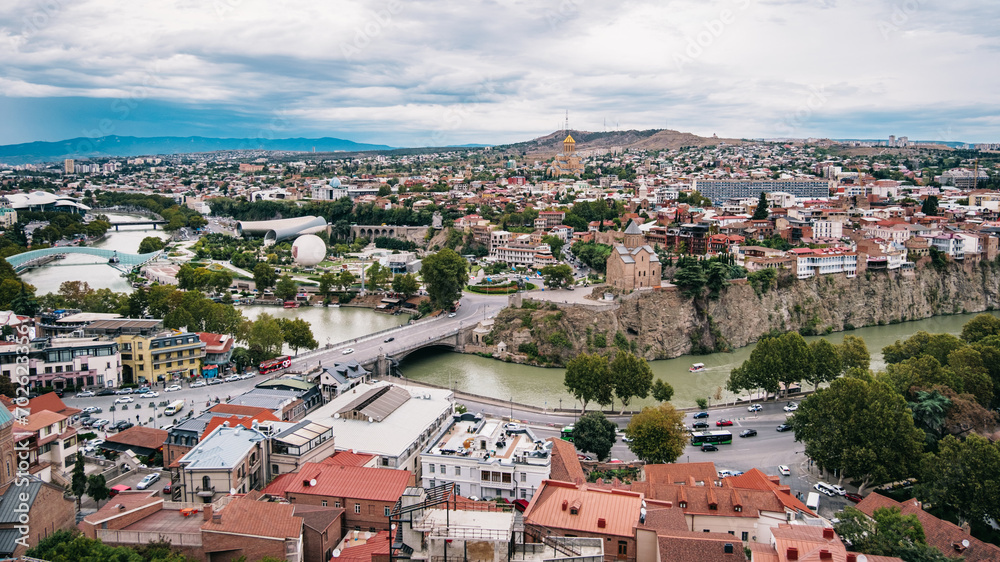 View of Tbilisi Old town with the Koura river, the bridge of peace, Metekhi church or even the Sameba cathedral (Georgia)