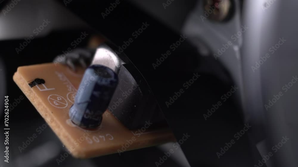 Video Cassette Tape Moving on Mechanism and Electronic Components of VHS Player, Macro Close Up