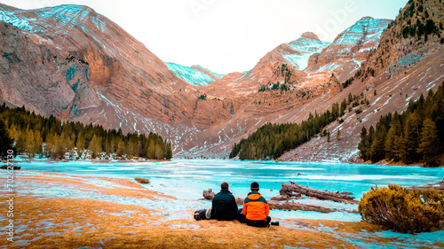 Cuadro en lienzo A Familys Winter Tale: Father and Son Create Lasting Memories on a Trunk in the