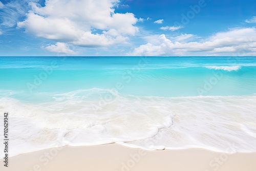 Pristine beach with clear turquoise waters under a blue sky