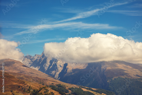 Mountain landscape with day sky and clouds. View from Grossglockner High Alpine Road. Austria, Europe