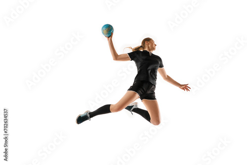 Caucasian woman honing her handball skills, showcasing precision in ball handling against clean white studio background. Concept of professional sport, movement, dynamic, workout, championship.