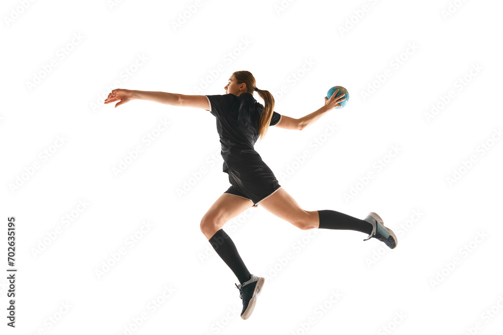 Talented handball player, female sportsman practicing techniques, capturing intensity of sport against white studio background. Concept of hobby, movement, dynamic, active lifestyle, championship.