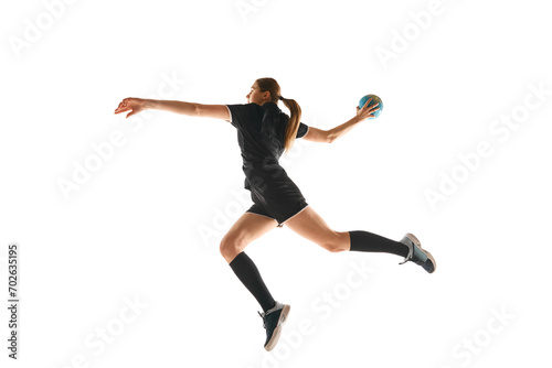 Talented handball player, female sportsman practicing techniques, capturing intensity of sport against white studio background. Concept of hobby, movement, dynamic, active lifestyle, championship.