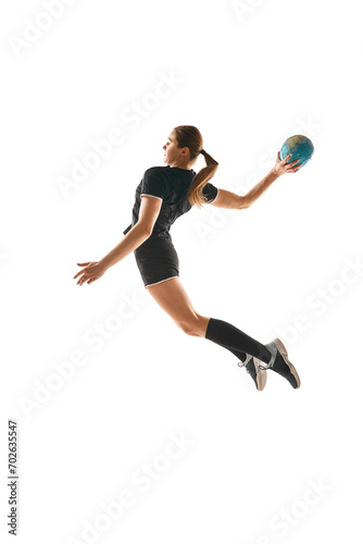 Determined woman, handball player in action, exhibiting focus and energy during training against white background. Concept of professional sport, hobby, movement, dynamic, workout, championship. Ad