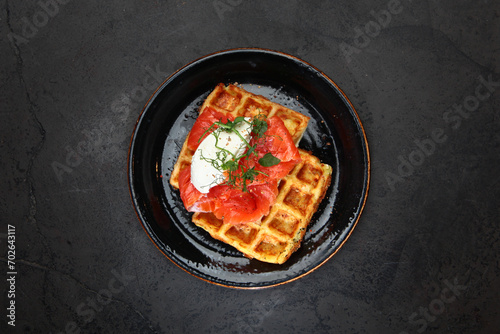 Belgian waffles with red fish. A healthy breakfast. Top view. Copy space.