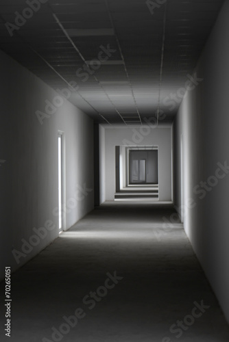 Fototapeta Naklejka Na Ścianę i Meble -  Empty corridor with light from the window. A light in the end of a tunnel