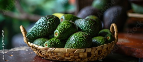 Avocado sold in a basket, fresh and delicious.
