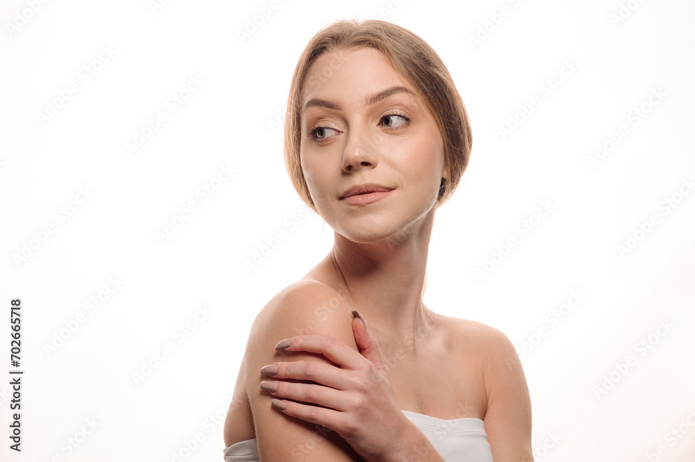 Beauty portrait of a pretty blonde girl posing on an isolated white background Beauty portrait of a pretty blonde girl posing on an isolated white background