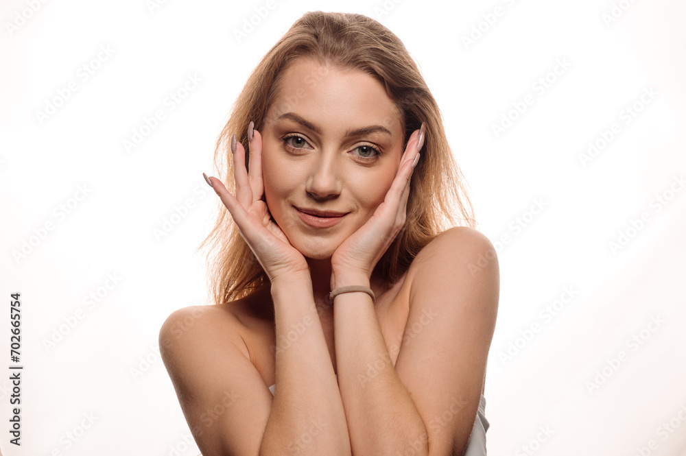 Portrait of beautiful blonde girl in beauty style with smooth clean skin on isolated white background Portrait of beautiful blonde girl in beauty style with smooth clean skin on isolated white background