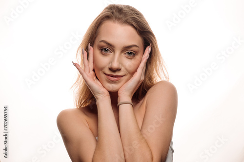 Portrait of beautiful blonde girl in beauty style with smooth clean skin on isolated white background