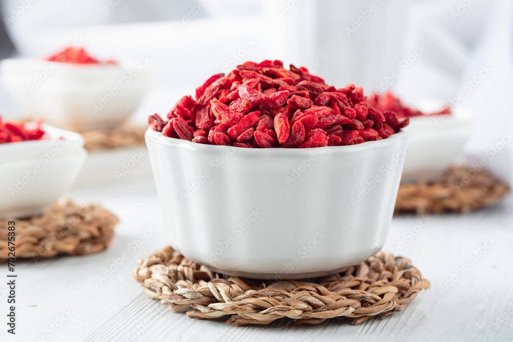 Dried goji berries on a white table. Dried goji berries on a white table.