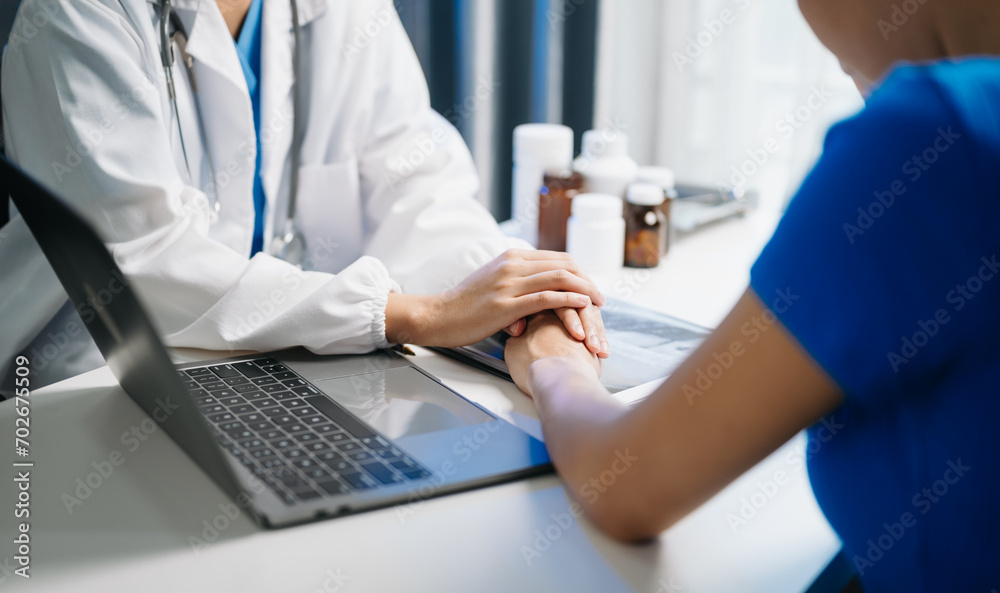 Female doctor filling up an application form while consulting patient. Medicine and health care concept. to meet patients after x-ray Female doctor filling up an application form while consulting patient. Medicine and health care concept. to meet patients after x-ray