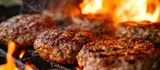 High angle view of barbecue burgers, prepared by grilling beef or pork meat over an open flame.