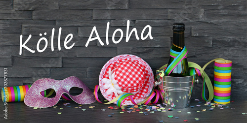 Luftschlangen,Konfetti und Karnevalszubehör mit dem Text Kölle Aloha.  Kölle Aloha  Ausruf der schwulen Community zum Karneval in Köln photo