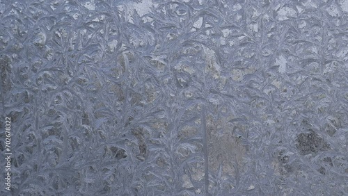 A frozen window close-up. Frosty drawing on the window