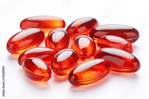 Red krill oil pills or globules isolated on a white background