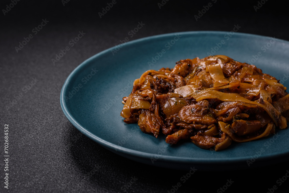 Delicious asian udon dish with vegetables, mushrooms, salt and spices Delicious asian udon dish with vegetables, mushrooms, salt and spices