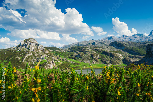 Scenic view of Covadonga Lakes in Asturias, Spain against a cloudy blue sky © Wirestock