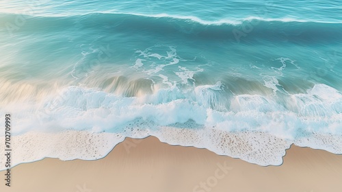 Aeriel view. Calm turquoise ocean waves, virgin beach sand. Banner of summer holidays. Drone photo.