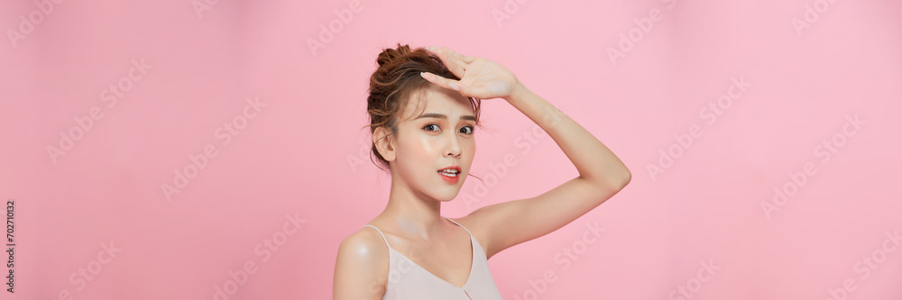 Beautiful Asian young woman hand up cover face protect sun light and UV smile with clean fresh skin Beautiful Asian young woman hand up cover face protect sun light and UV smile with clean fresh skin