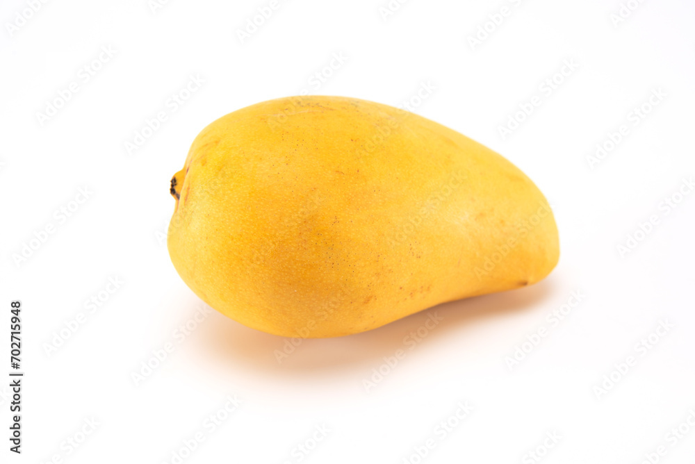 Ripe whole mango isolated on white background.