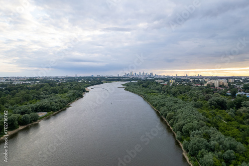 From a drone's perspective, the Vistula River in Warsaw unveils its scenic beauty, winding through the cityscape. 