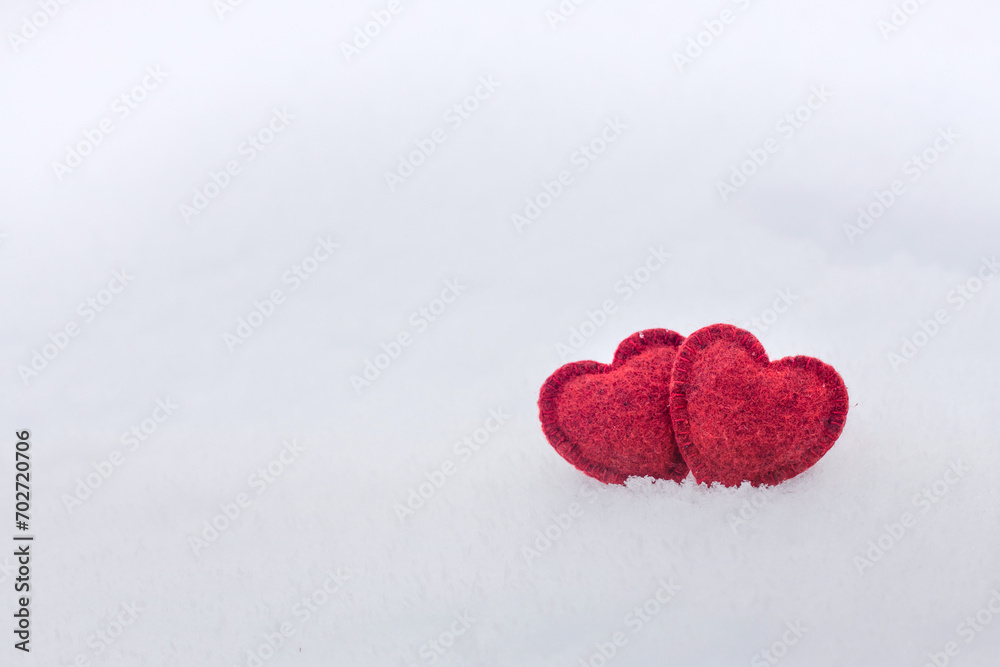 Two Red hearts on snow in winter. Happy valentines day celebration. Heart love concept. Two Red hearts on snow in winter. Happy valentines day celebration. Heart love concept.