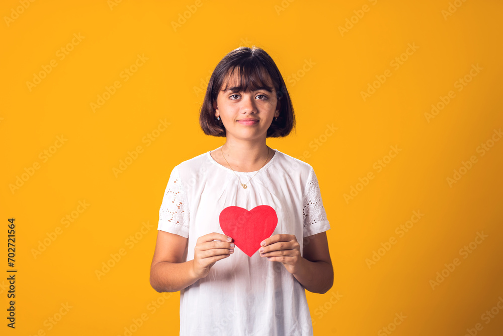 Child girl holding paper heart. Love, Valentine day concept Child girl holding paper heart. Love, Valentine day concept