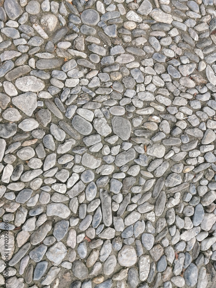 Fondo de cantos rodados tipico asfalto de las calles de Granada