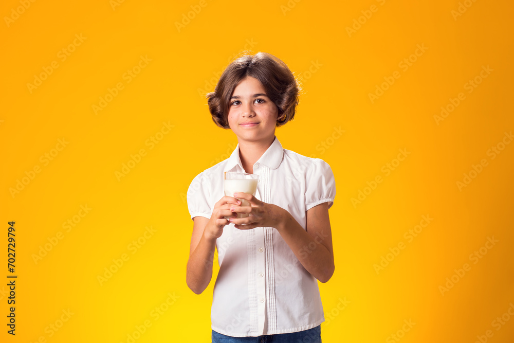 Child girl holding glass of milk. Nutrition and health concept Child girl holding glass of milk. Nutrition and health concept