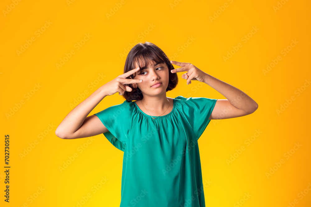 Smiling kid girl over yellow background. Emotion concept Smiling kid girl over yellow background. Emotion concept
