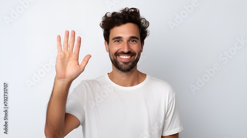 A friendly person waving with a smile in a welcoming gesture , friendly person, waving, smile, welcoming gesture photo