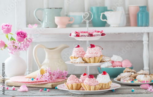 pink cakes on plate on white background