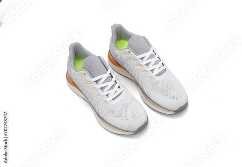 trendy light color sneaker pairs isolated on white background