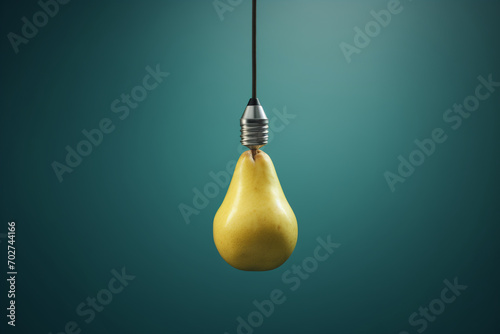 Light bulb in shape of pear on blue background. Minimal creative concept. ECO energy idea concept. © Femmes.Digital