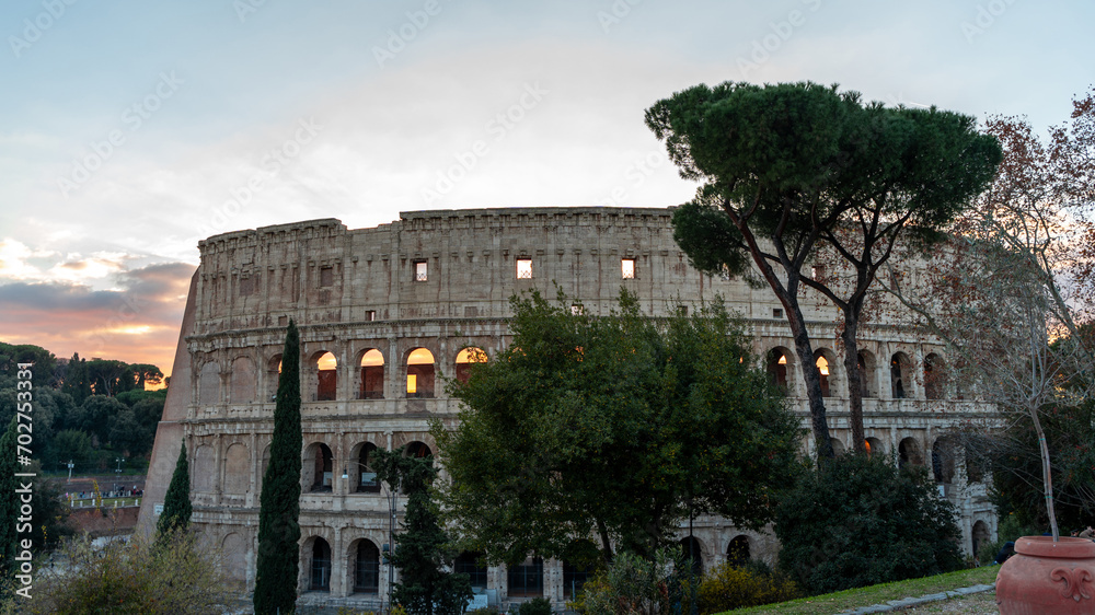 Panoramic view of the Colosseum amphitheater in Rome at sunset