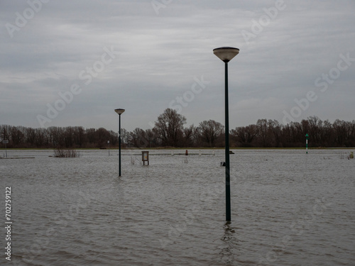 Flooded parkingplace by the river Nederrhine in the Netherlands. Place: Wijk bij Duurstede photo