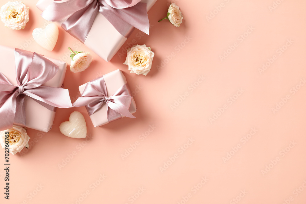 Happy Valentines Day concept. Greeting card design with gift boxes, heart shaped candles, flowers on peach fuzz color background. Top view, flat lay.