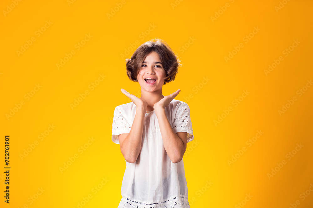 Smiling kid girl over yellow background. Emotion concept Smiling kid girl over yellow background. Emotion concept