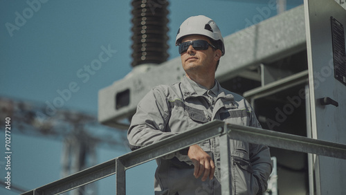 Portrait of a power plant worker near a transformer